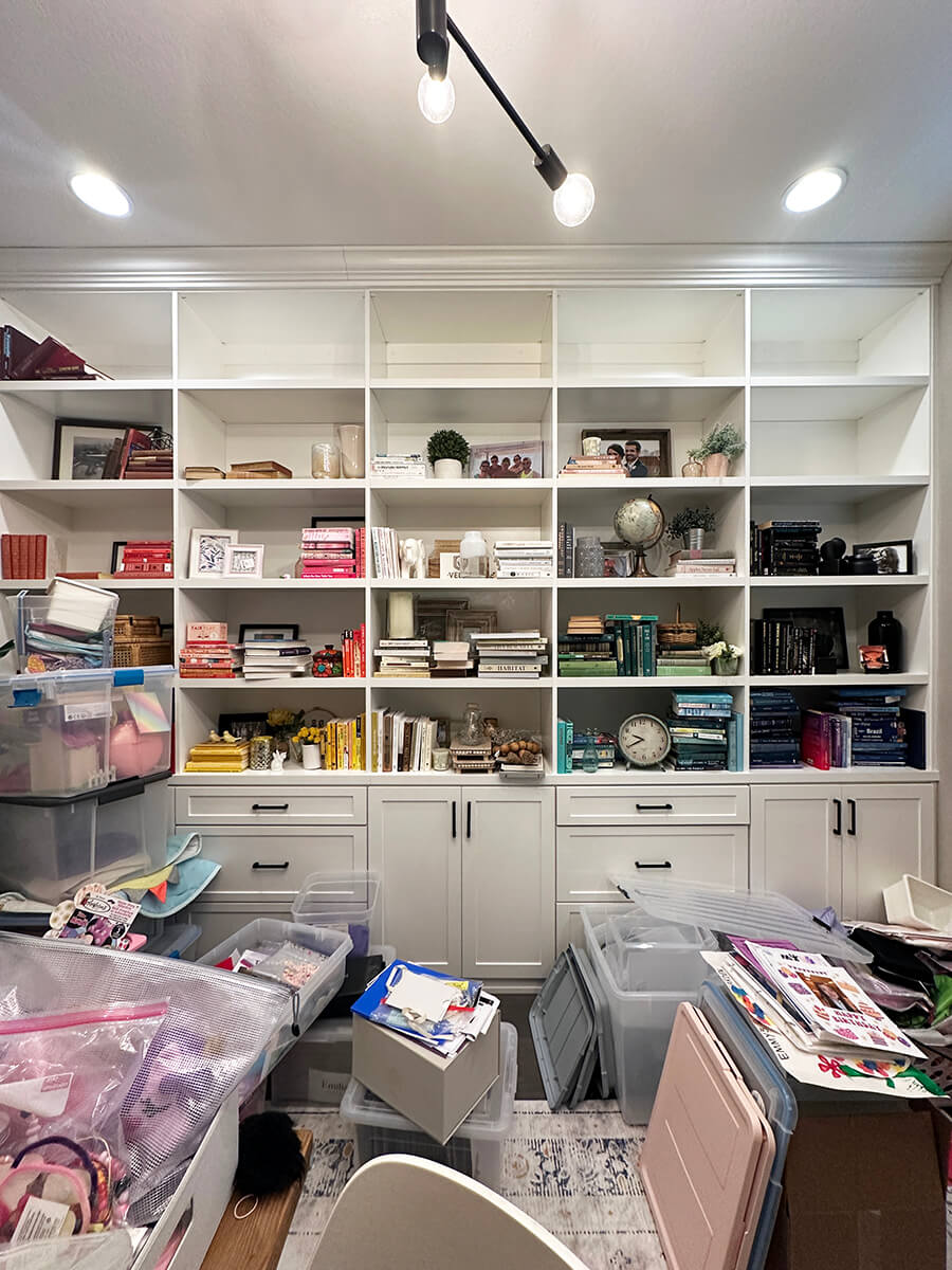 Disorganized office archive shelves with mixed binders and loose papers before Lifelystyle confidential office organization in Las Vegas