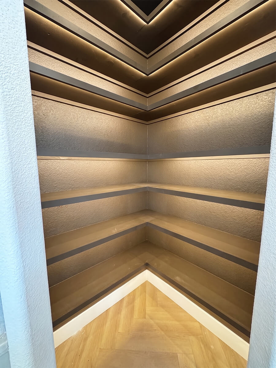 Empty built-in shelves in a vacant Las Vegas luxury listing before professional staging — flat, undifferentiated, missed selling opportunity