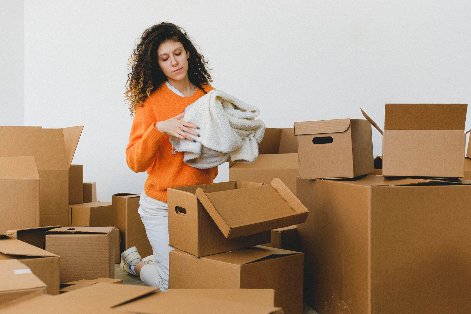 Sorting and packing belongings into boxes during a downsize
